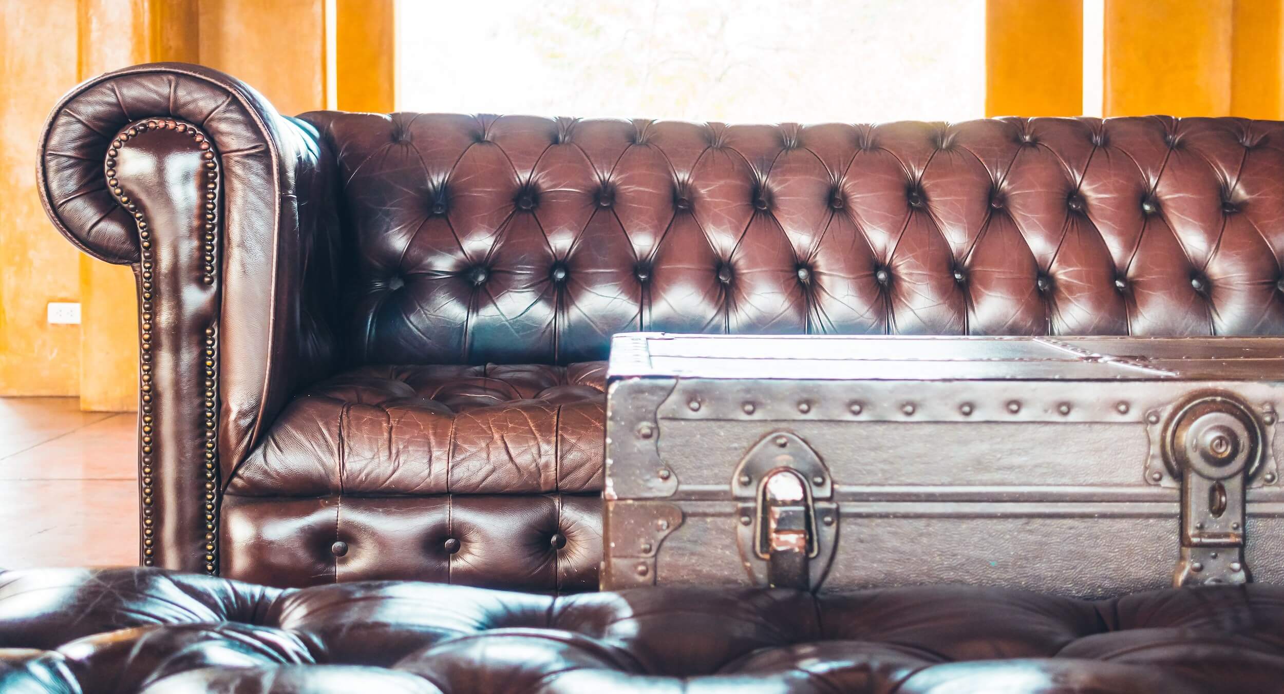 Large vintage leather couch and trunk