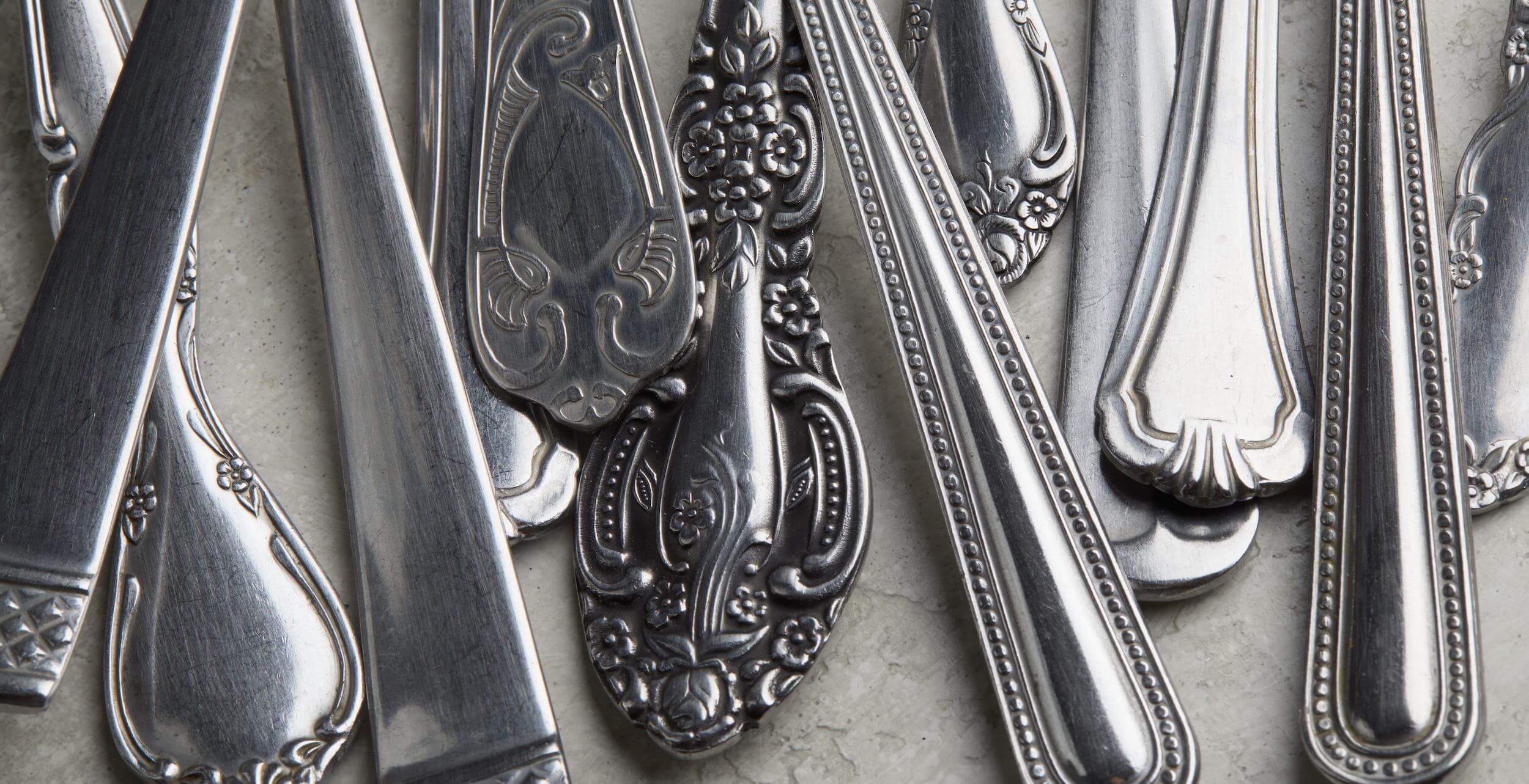 silver forks and spoons with antique patterns